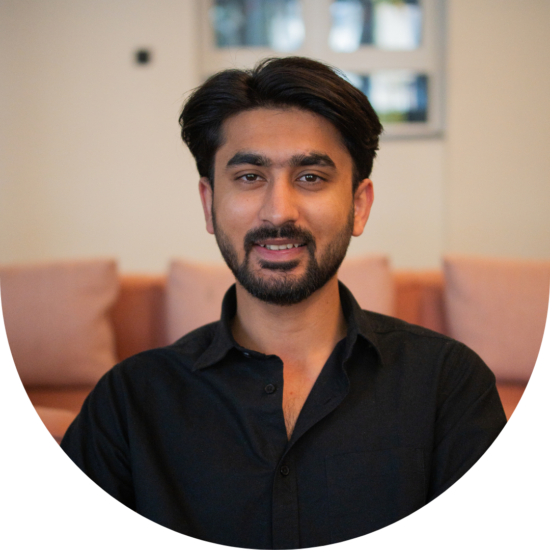 Person with beard and dark hair wearing a black shirt