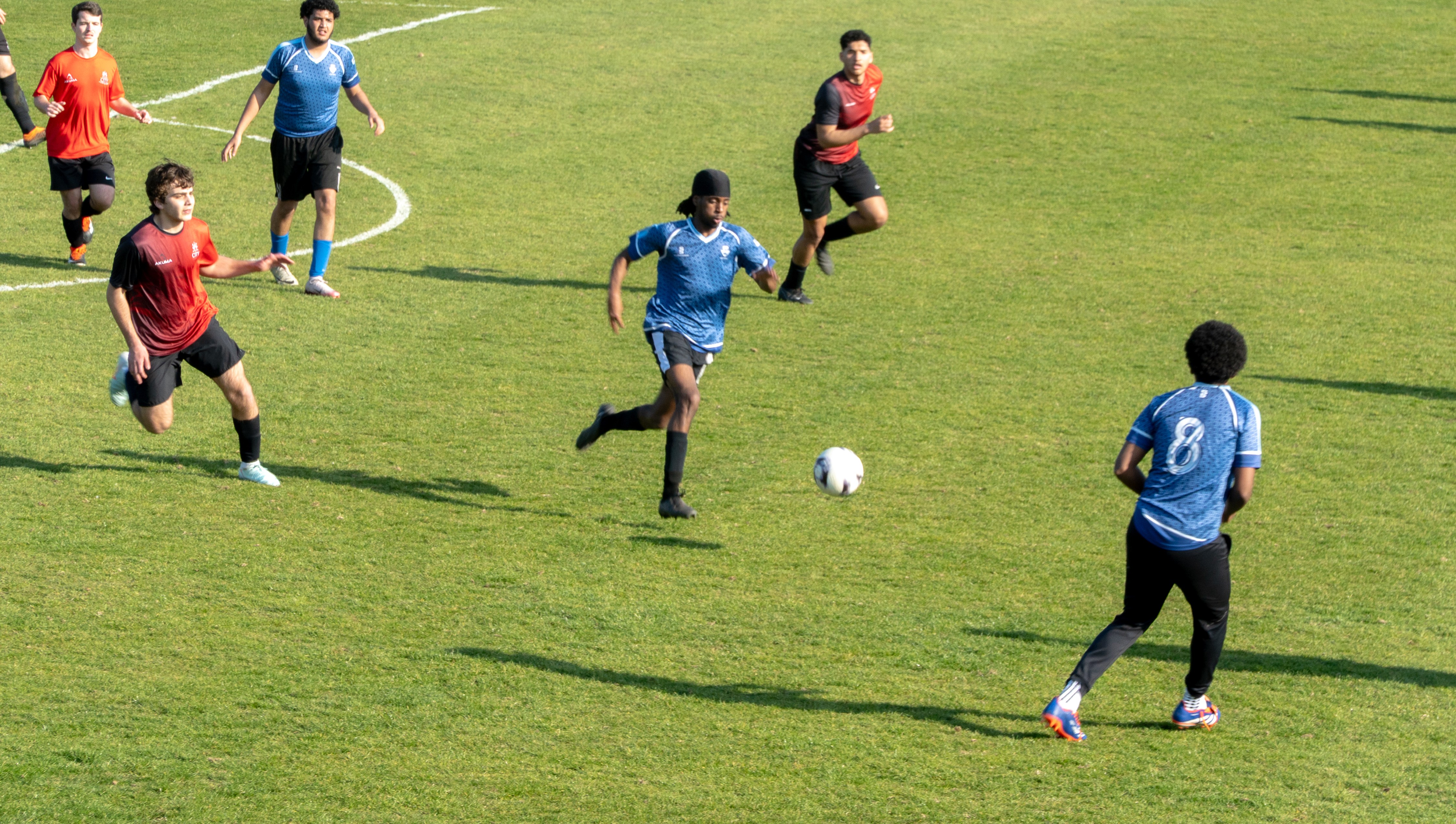Image of footballers playing a match